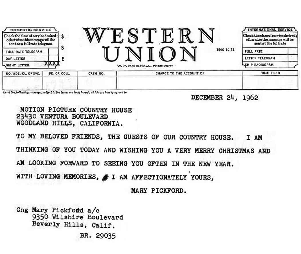 A telegram dated December 24, 1962, from Mary Pickford to the guests of Motion Picture Country House, sending Christmas and New Year greetings. The telegram includes the sender’s address in Beverly Hills.